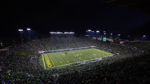 Autzen Stadium football field lit up for a night game