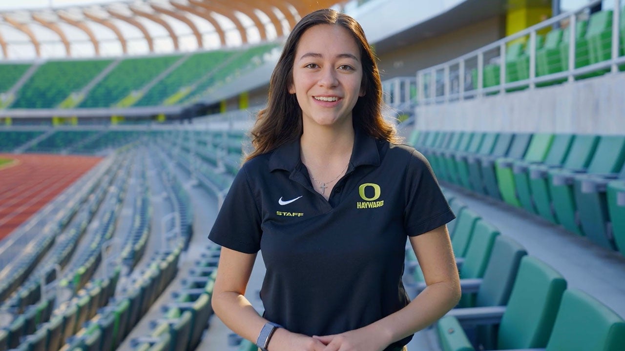 Natasha Reyes facing the camera with the stands of Hayward Field in the background