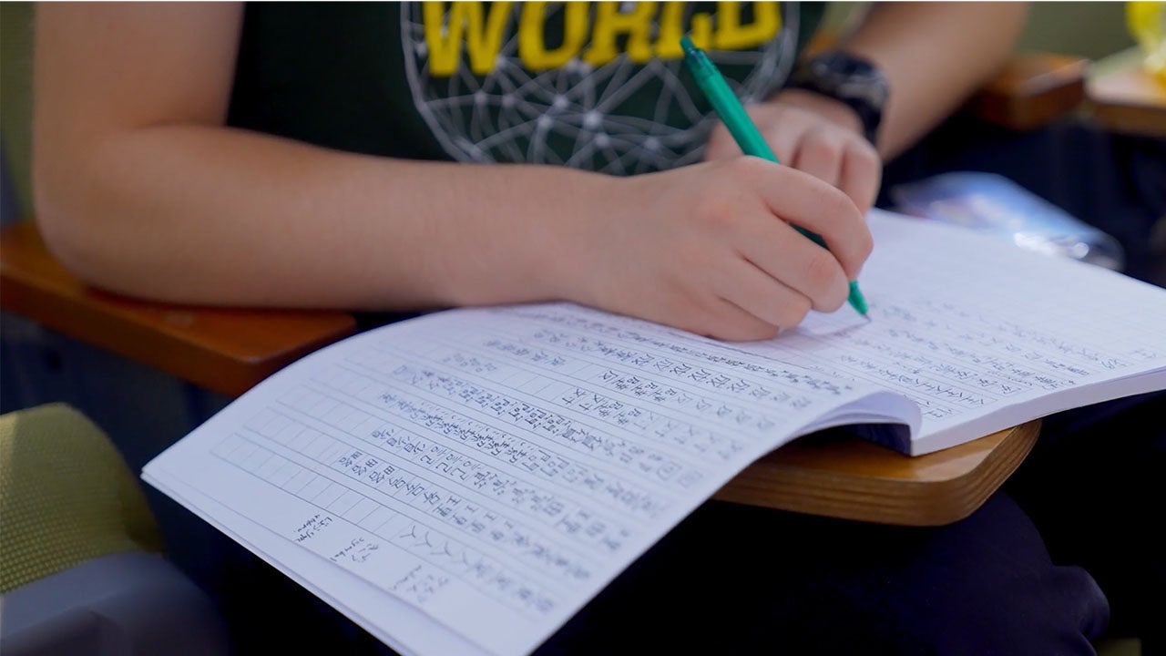 Photo of student writing in chinese