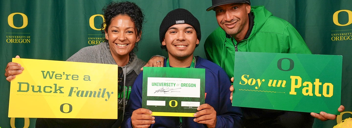 A family showing their acceptance to the UO